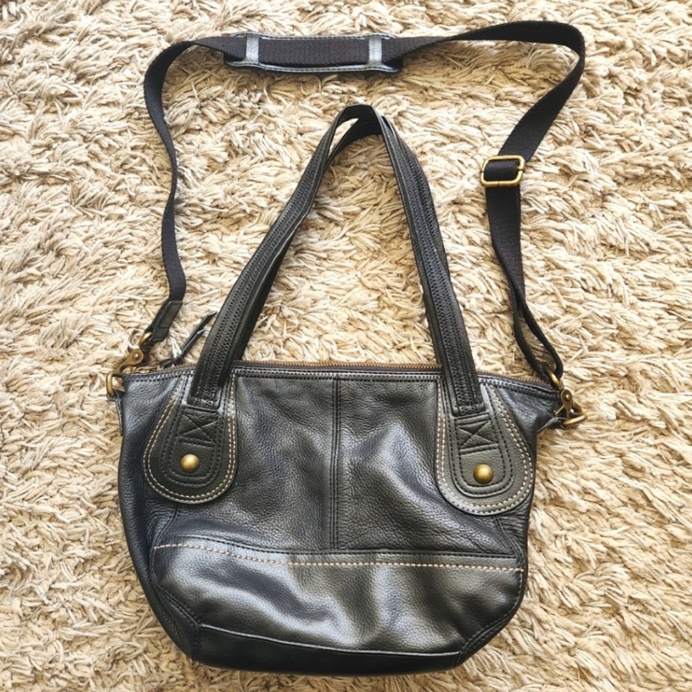 The Sak brand black purse